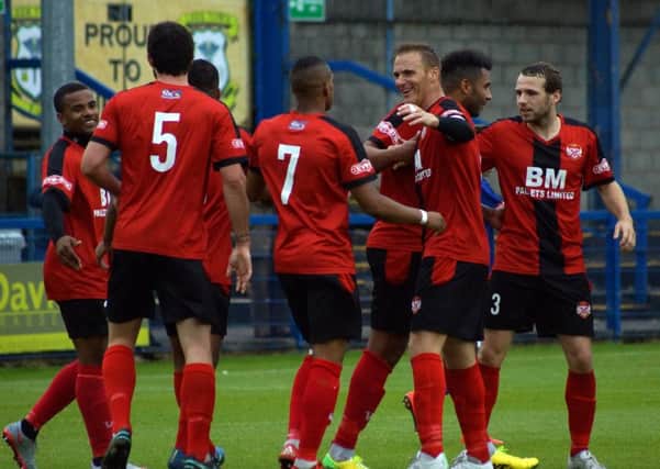 Kettering Town's players will be hoping to replicate their impressive away form when they return to Latimer Park to take on Banbury United this weekend. Picture by Peter Short