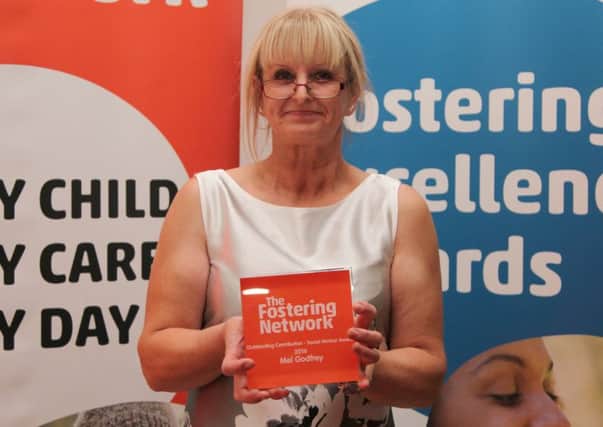 Northamptonshire County Council social worker Mel Godfrey with her Fostering Excellence Award