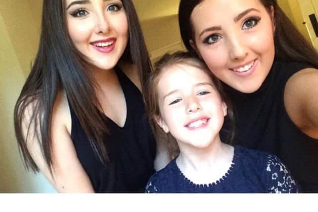 Eve with her sisters Meg and Beth