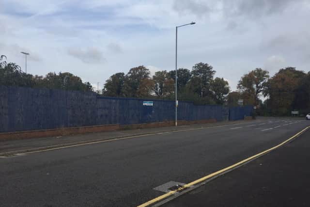 The boarded-up piece of land which Wrenn Academy wants to build a new sports hub on
