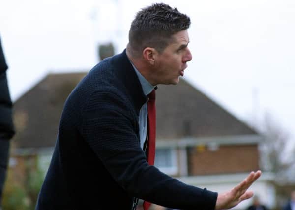 Poppies boss Marcus Law gives out instructions during the 5-1 victory over Market Drayton Town. Picture by Peter Short