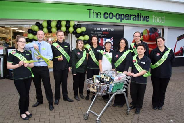 Staff outside the newly refurbished store