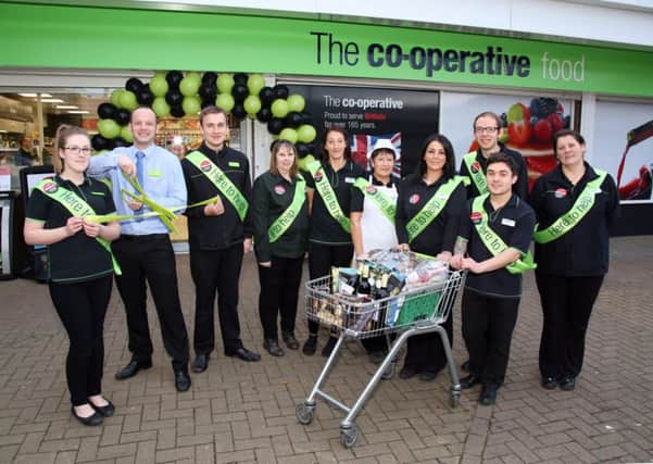 Staff outside the newly refurbished store