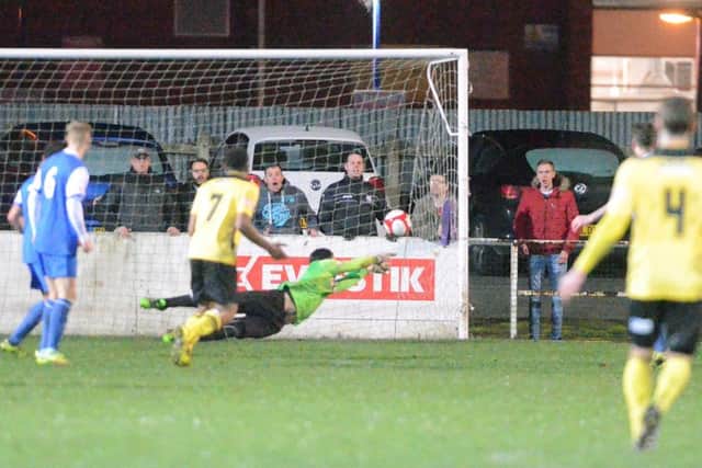 Spalding goalkeeper Michael Duggan is beaten by Richard Bunting's shot for Diamonds' equaliser