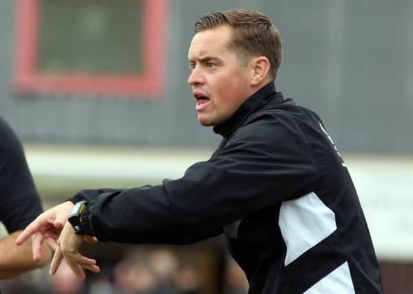 Corby Town boss Gary Mills was delighted after securing the loan signing of striker Stefan Moore