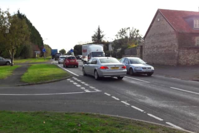 Traffic passing through Isham.