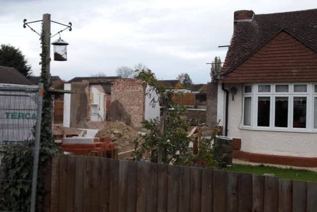 The building site, next to the adjacent bungalow.