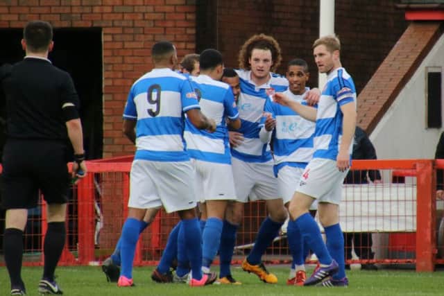 The Poppies celebrate Liam Canavan's early goal at Witton