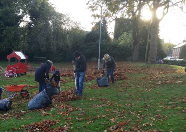 Broughton residents collect leaves.