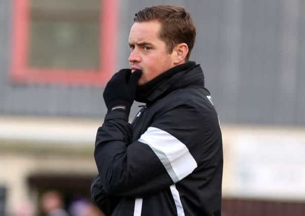 Gary Mills has warned his Corby Town team they will have to battle in their bid to survive