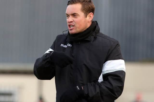 Corby Town boss Gary Mills had mixed feelings after his team's 3-3 draw with Ashton United at Steel Park. Pictures by Alison Bagley