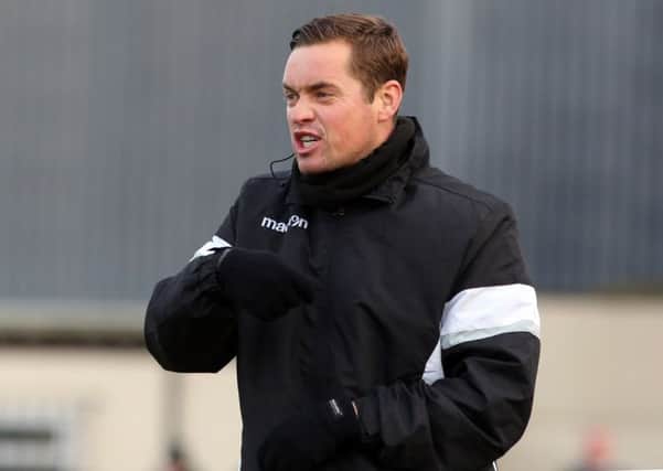 Corby Town boss Gary Mills had mixed feelings after his team's 3-3 draw with Ashton United at Steel Park. Pictures by Alison Bagley