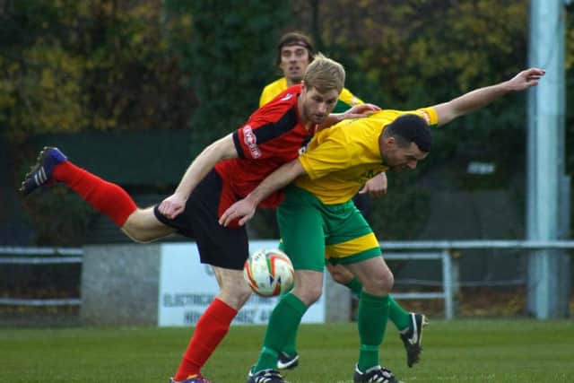 Gary Mulligan battles for the ball during the Poppies' goalless draw at Hitchin