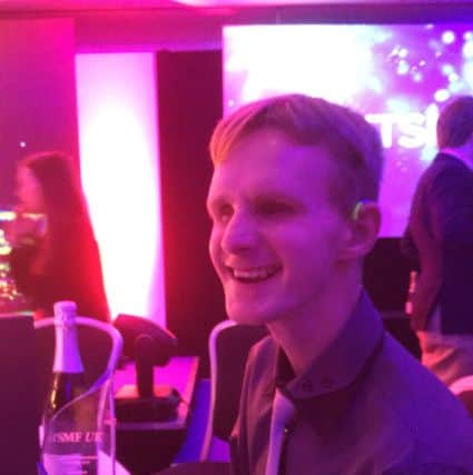 Lewis with the award he has just won