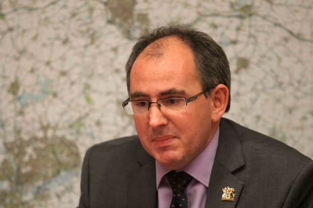 Chief executive Paul Blantern was labelled a Scrooge by opposition councillors - because staff were not paid a promised Â£600 pay-rise.