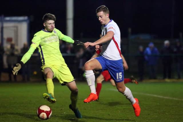 Jake Newman tries to get past the Markeyt Drayton goalkeeper at the Dog & Duck