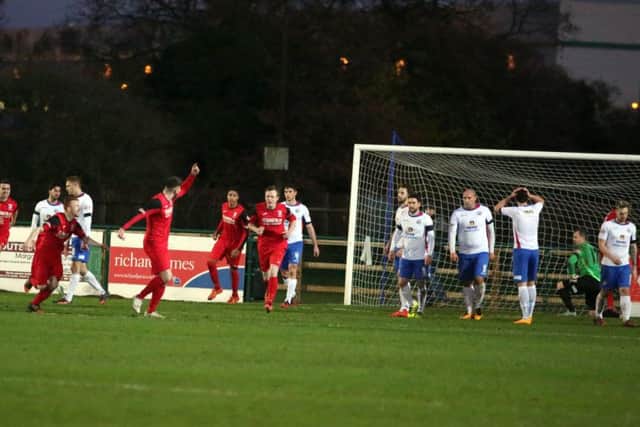 Market Drayton Town celebrate their equaliser in the 1-1 draw at AFC Rushden & Diamonds. Pictures by Alison Bagley