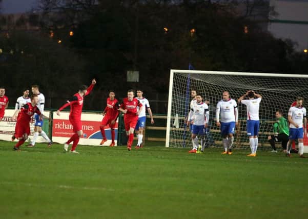 Market Drayton Town celebrate their equaliser in the 1-1 draw at AFC Rushden & Diamonds. Pictures by Alison Bagley