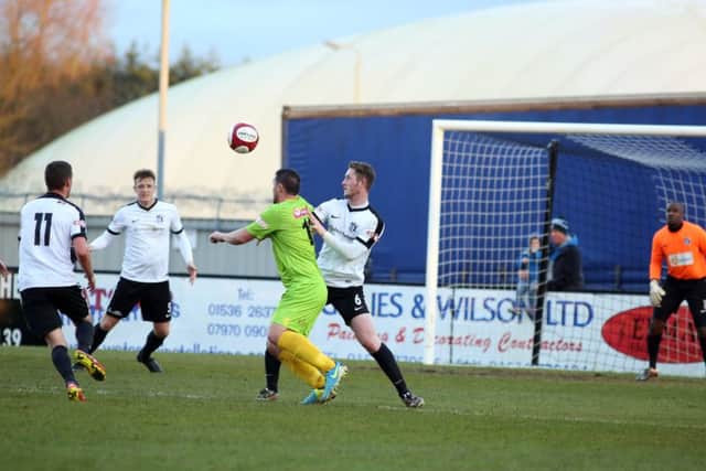 Brad-Lee Gascoigne battles with former team-mate Callum Ball, who scored for Barwell in their win at Corby Town. Pictures by Alison Bagley