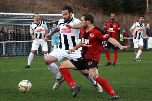 James Brighton battles for possession