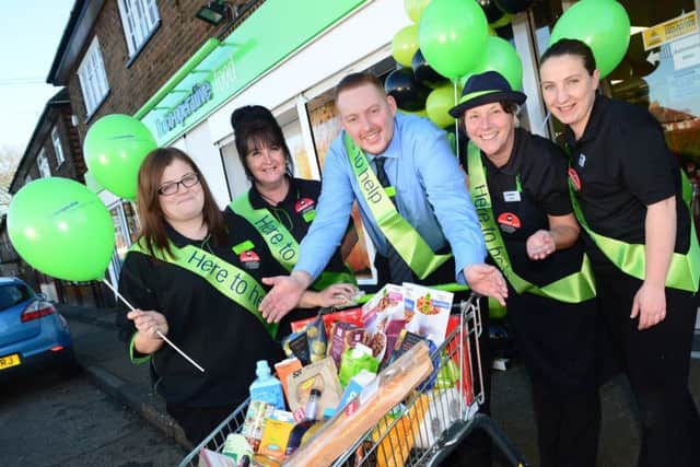 Staff at the revamped store in Occupation Road, Corby