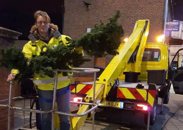 Rushden mayor Tracey Smith helping out with the Christmas decorations