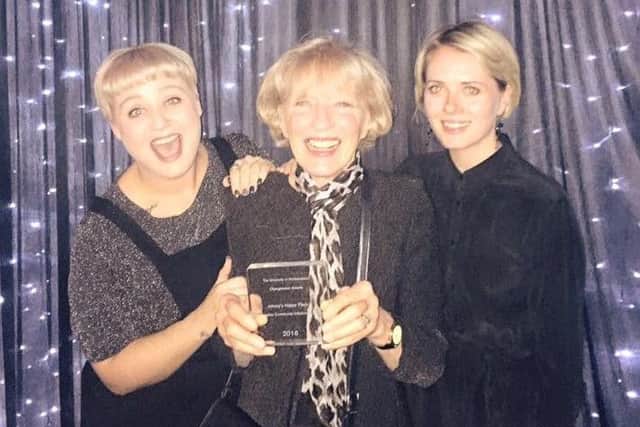 Denise Mackay with the award for Johnny's Happy Place