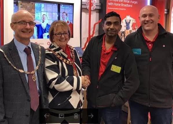 Bob Riley, Corby mayor Julie Riley, Vodafone store manager Rav Pyro  and regional manager Steve Price