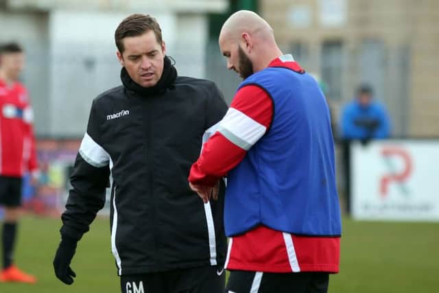 Corby Town boss Gary Mills says he and assistant David Bell must 'lead from the front' following a shocking 5-1 defeat at Sutton Coldfield Town