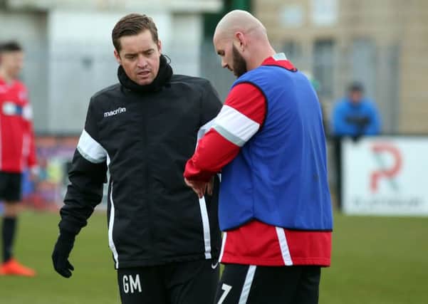 Corby Town boss Gary Mills says he and assistant David Bell must 'lead from the front' following a shocking 5-1 defeat at Sutton Coldfield Town