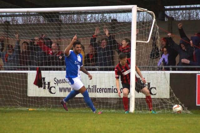 Rene Howe and the travelling Kettering Town fans celebrate one of their goals during the 6-1 success at Cirencester Town