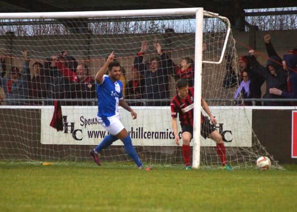 Rene Howe and the travelling Kettering Town fans celebrate one of their goals during the 6-1 success at Cirencester Town