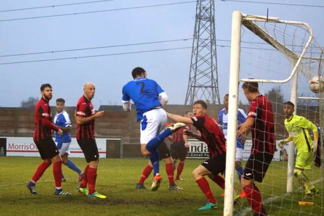 James Haran heads home one of his two goals for the Poppies