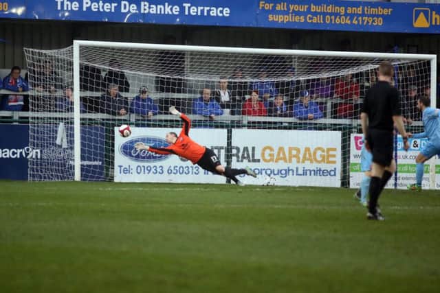 Matt Finlay is beaten by Andrew Toyne's shot during AFC Rushden & Diamonds' 1-1 draw with Lincoln United at the Dog & Duck. Pictures by Alison Bagley