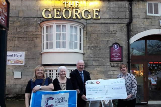 L-R: Lizzie Melvin, Jean and Noel Flynn and Louise Dempster with the cheque for £3,000.