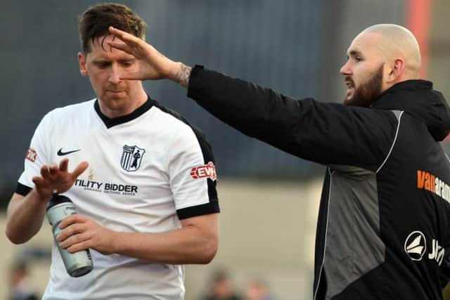 New signing Steve Kinniburgh talks it over with assistant-manager David Bell during the Steelmen's loss to Workington at Steel Park. Pictures by Alison Bagley