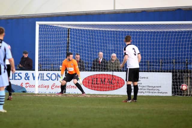 Corby goalkeeper Dan Farrell is left stranded as Joe McGee's shot gives Workington the lead