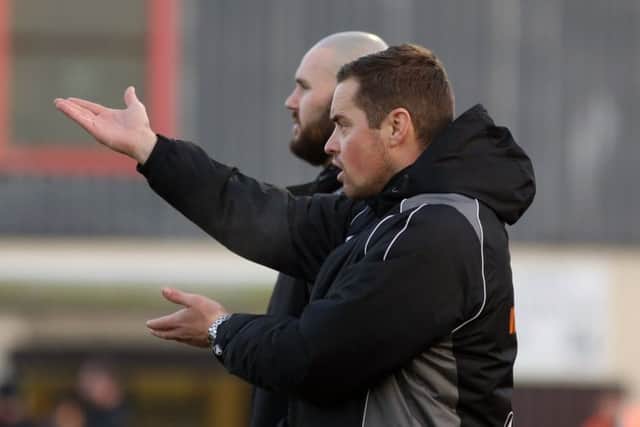 Gary Mills and David Bell give out the instructions during Corby Town's 3-1 defeat to Workington at Steel Park. Pictures by Alison Bagley