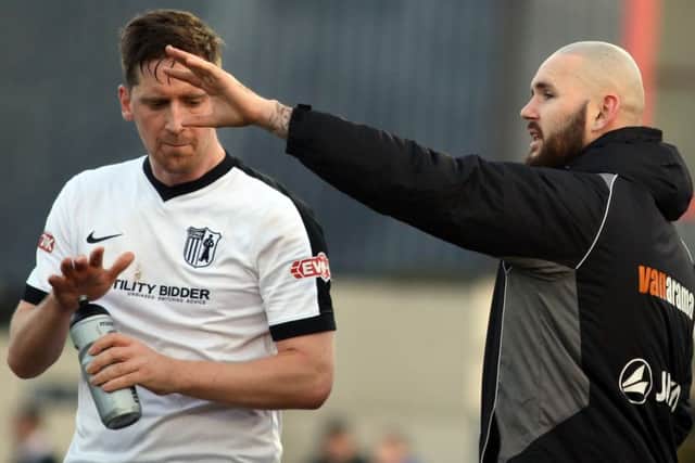 Steve Kinniburgh takes some instructions off assistant-manager David Bell during his debut for Corby Town last Saturday. Picture by Alison Bagley