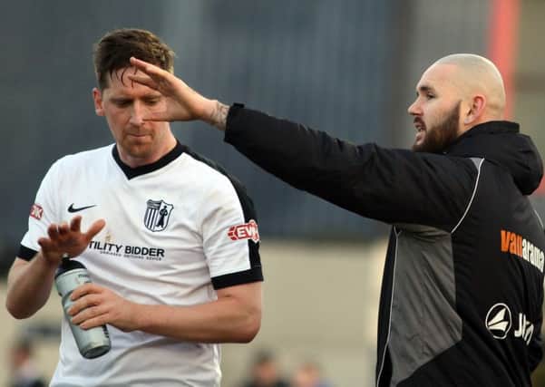 Steve Kinniburgh takes some instructions off assistant-manager David Bell during his debut for Corby Town last Saturday. Picture by Alison Bagley