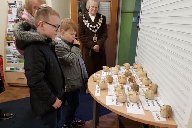 The winners choosing their favourite gargoyles