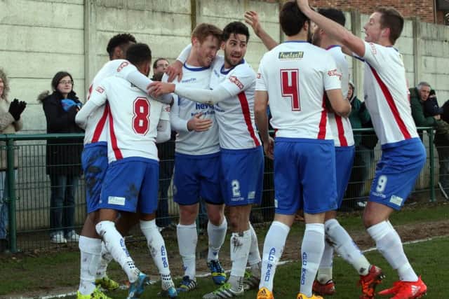 The AFC Rushden & Diamonds players celebrate Nabil Shariff's goal during the 1-1 draw with Stamford. Pictures by Alison Bagley