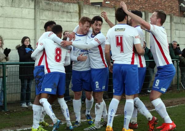 The AFC Rushden & Diamonds players celebrate Nabil Shariff's goal during the 1-1 draw with Stamford. Pictures by Alison Bagley