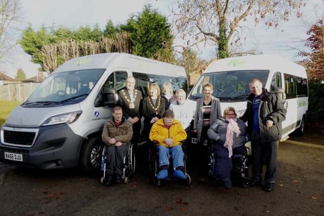 Cllrs Malcolm and Veronica Waters with members of Nene Valley Phab and the new minibuses