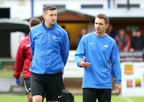 Jon Mitchell (right) has stepped down as Wellingborough Town boss with Stuart Goosey taking over