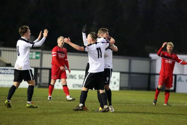 The Steelmen celebrate Stefan Moore's first goal, which put them 2-0 up