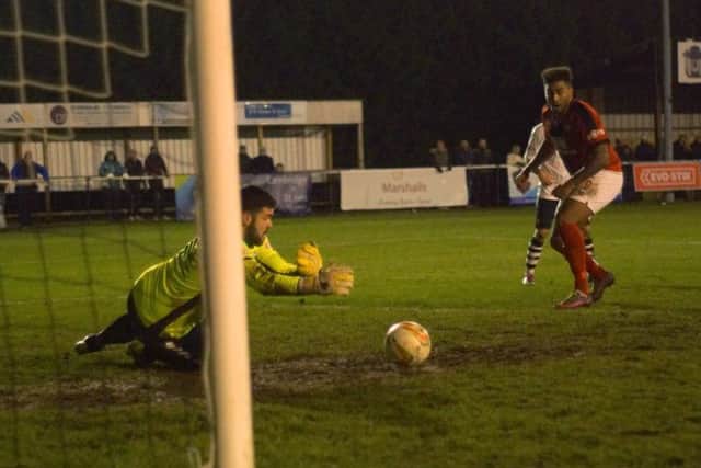 Rene Howe scores Kettering Town's winner as they completed a dramatic late fightback at Cambridge City. Pictures by Peter Short
