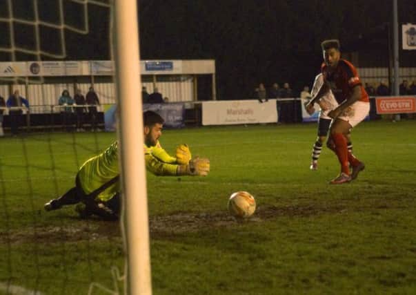 Rene Howe scores Kettering Town's winner as they completed a dramatic late fightback at Cambridge City. Pictures by Peter Short