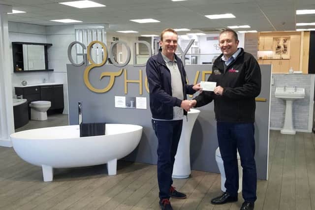 Karl Howell from Goodey & Howell and Plumbco handing over the cheque to Graham Campbell from Glamis Hall