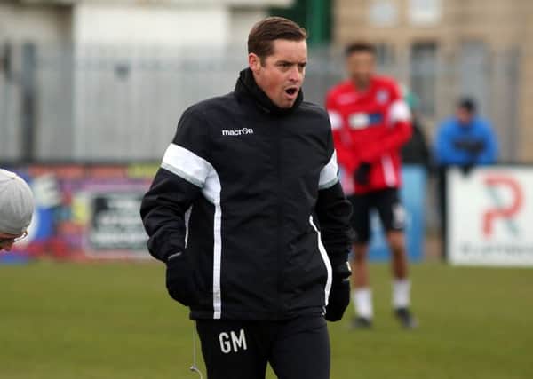 Corby Town boss Gary Mills insists his team can't get carried away after their recent upturn in fortunes